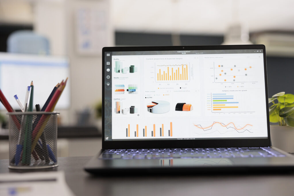 Laptop displaying financial graphs and data analytics